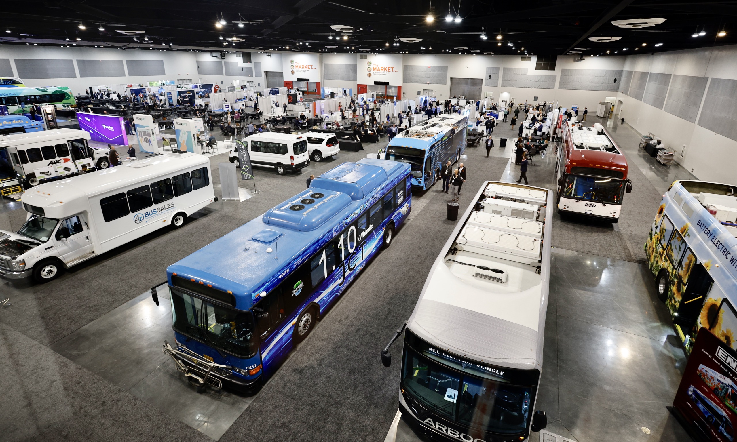 aerial shot of busses in line at parking lot